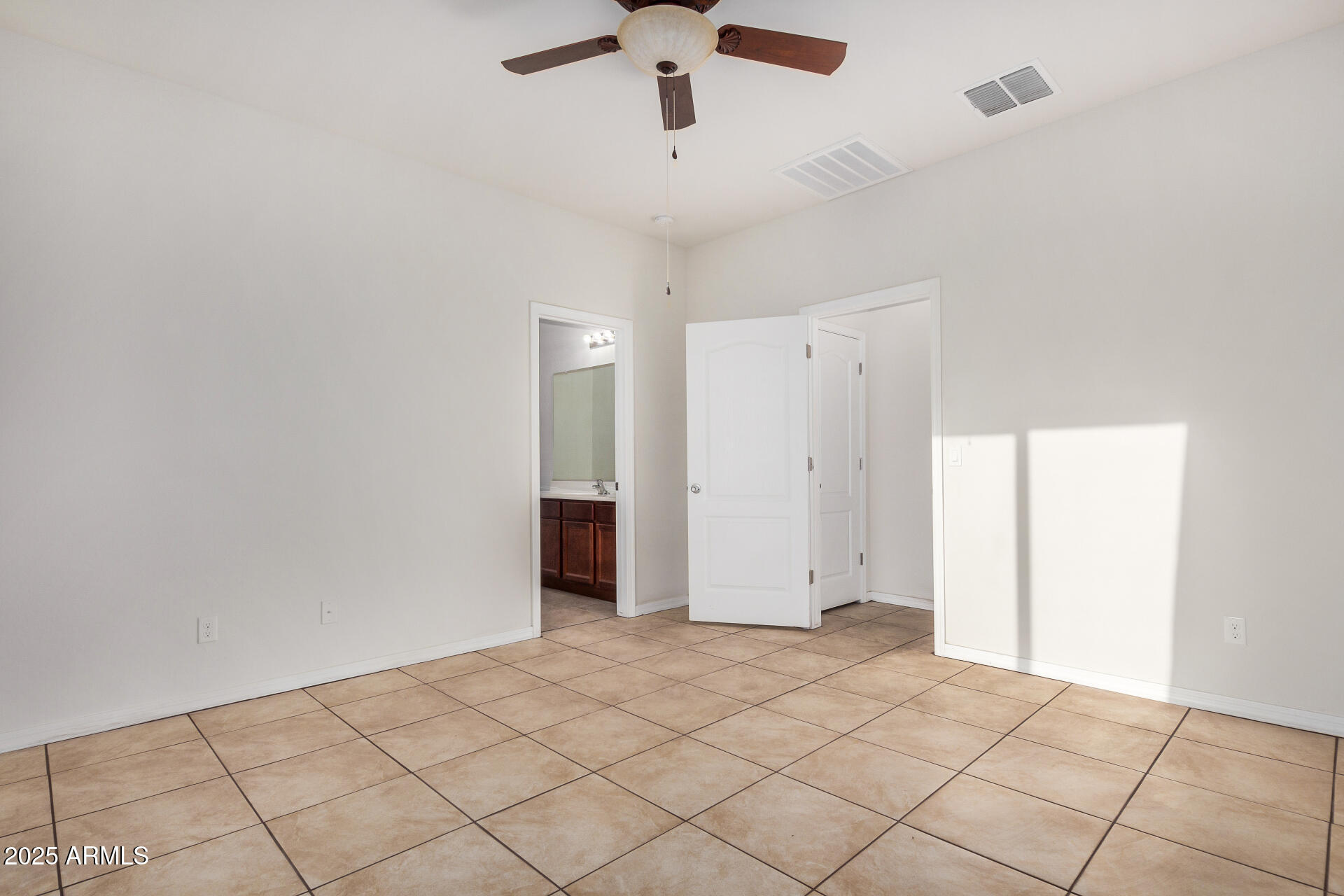 4880 South 246th Lane Buckeye, AZ 85326 - Photo 18 of 32 a view of an empty room
