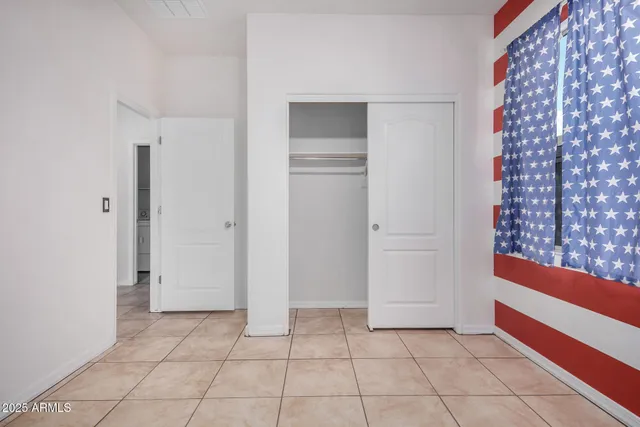 a white bath tub sitting next to a white toilet