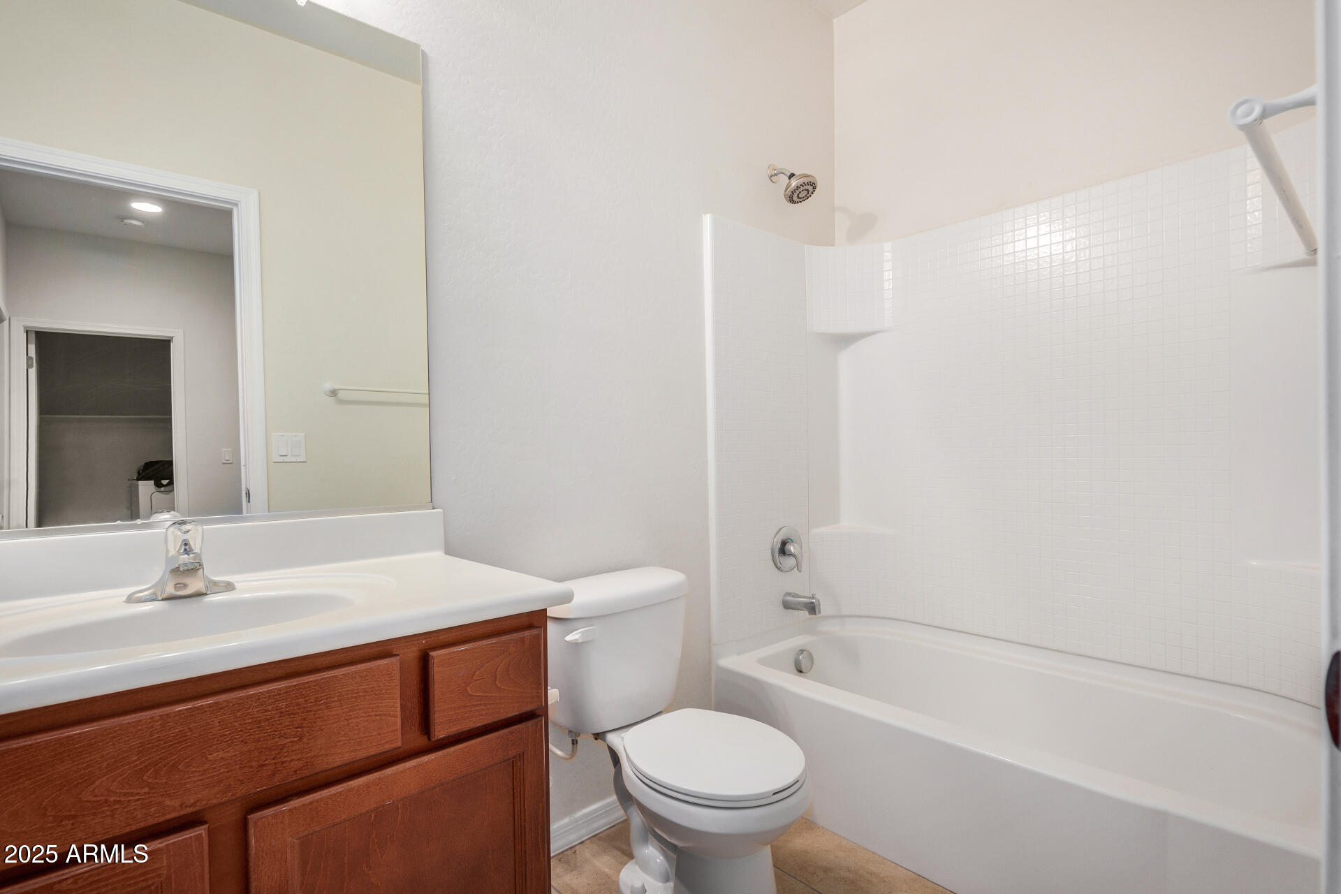 4880 South 246th Lane Buckeye, AZ 85326 - Photo 26 of 32 a bathroom with a sink a toilet and shower