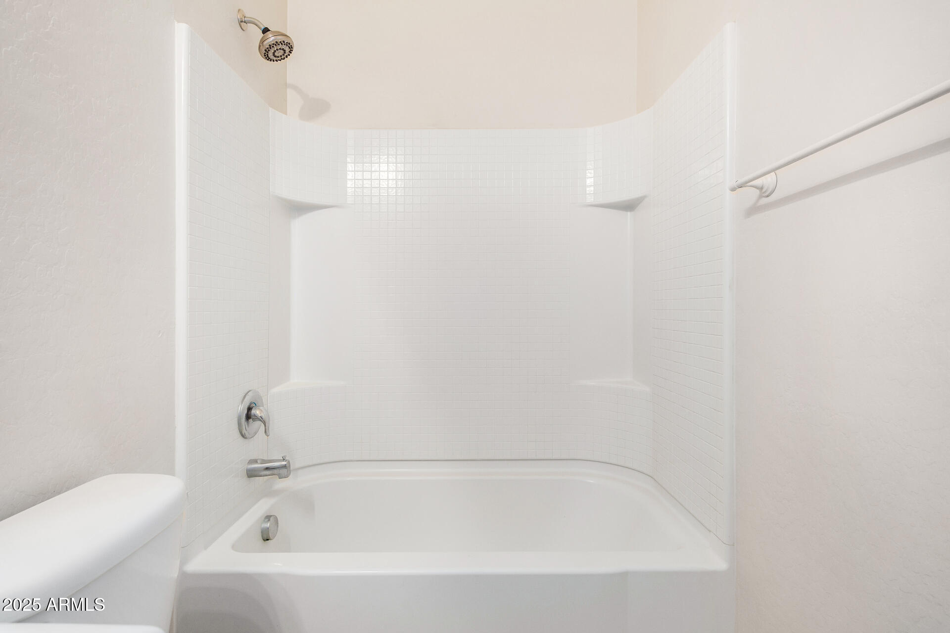 4880 South 246th Lane Buckeye, AZ 85326 - Photo 27 of 32 a white bath tub sitting next to a white toilet