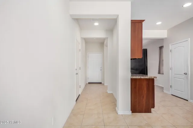 a view of a hallway with a bathroom