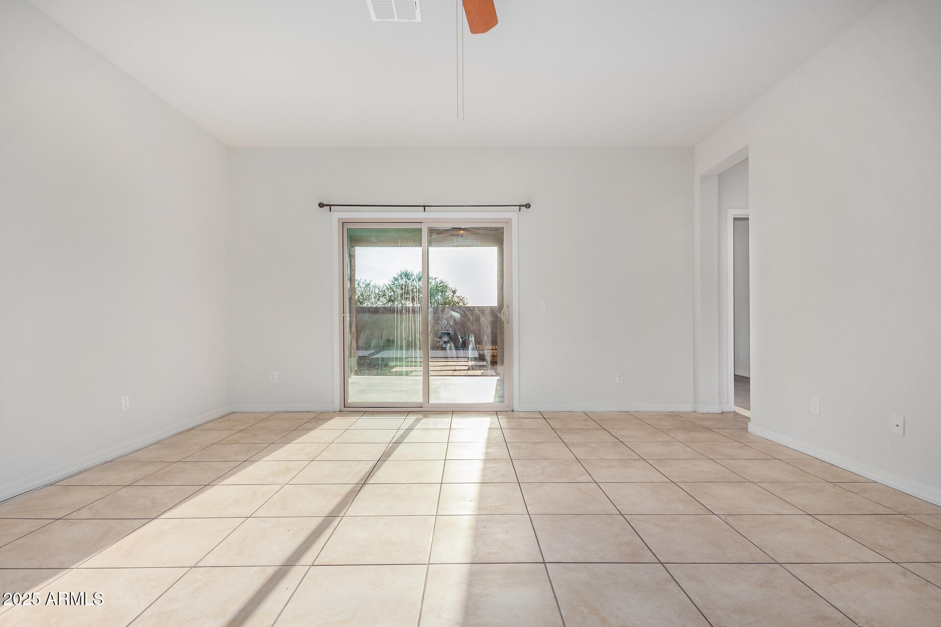 4880 South 246th Lane Buckeye, AZ 85326 - Photo 6 of 32 a view of an empty room and window