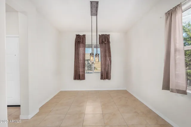 a kitchen with stainless steel appliances granite countertop a refrigerator and a stove