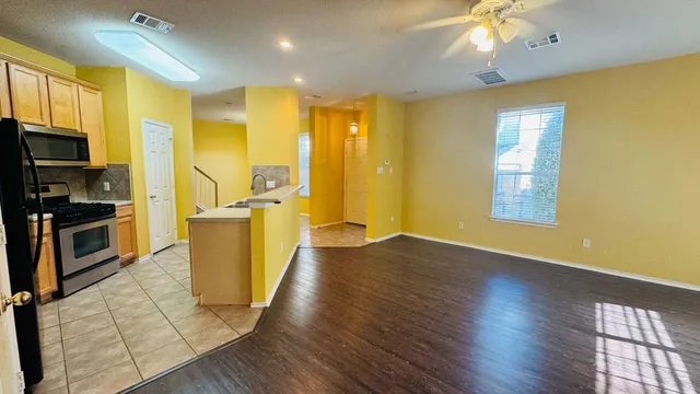 a view of a swimming pool with chairs