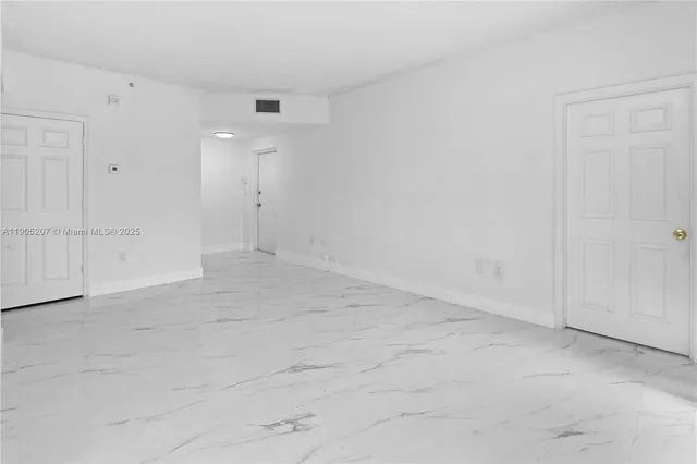 an empty room with an entryway