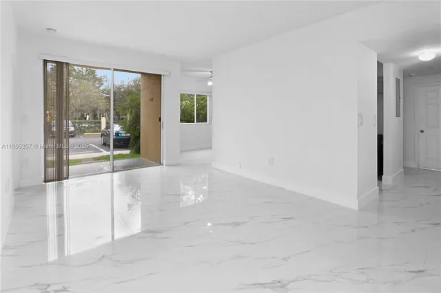 a view of a room with sliding glass door and mountain view