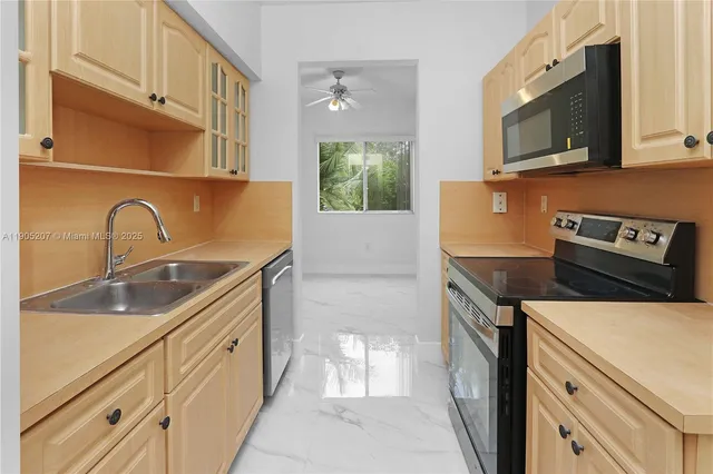 a kitchen with a stove microwave and sink
