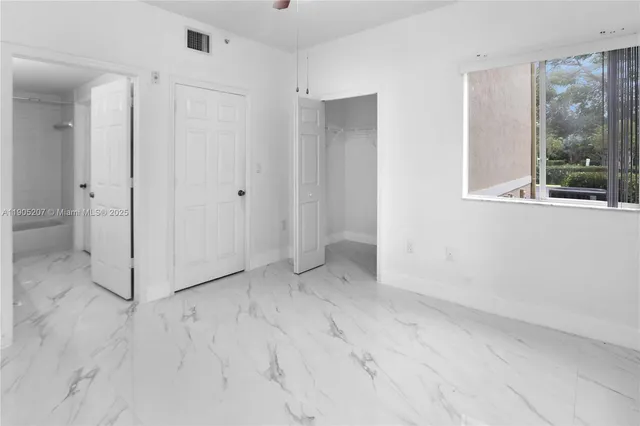 a view of a room with a large window