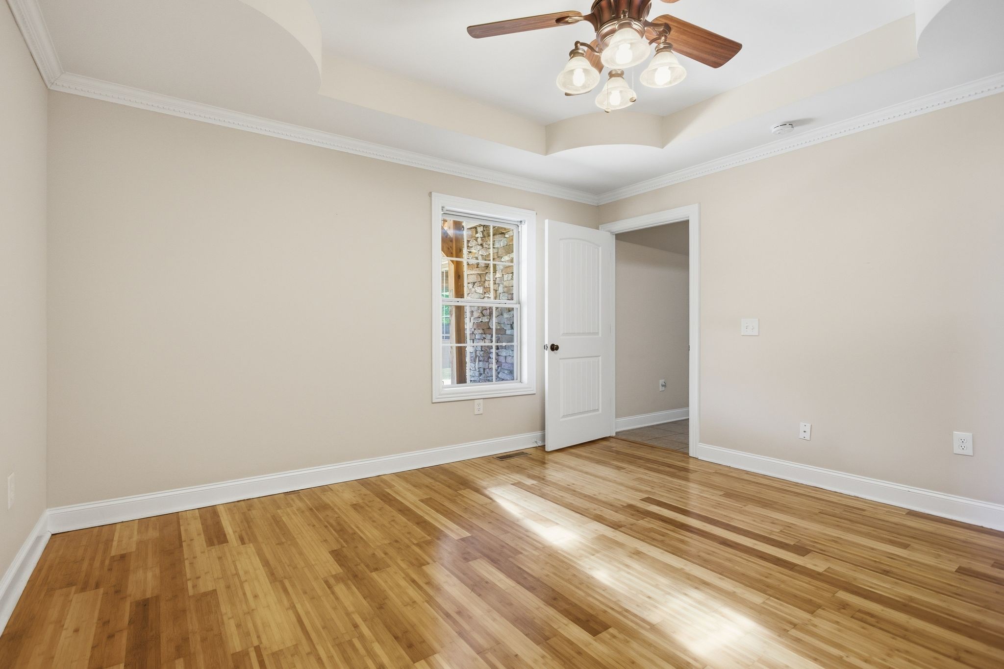408 Weakley Creek Road Lawrenceburg, TN 38464 - Photo 17 of 41 a view of an empty room with wooden floor and a window