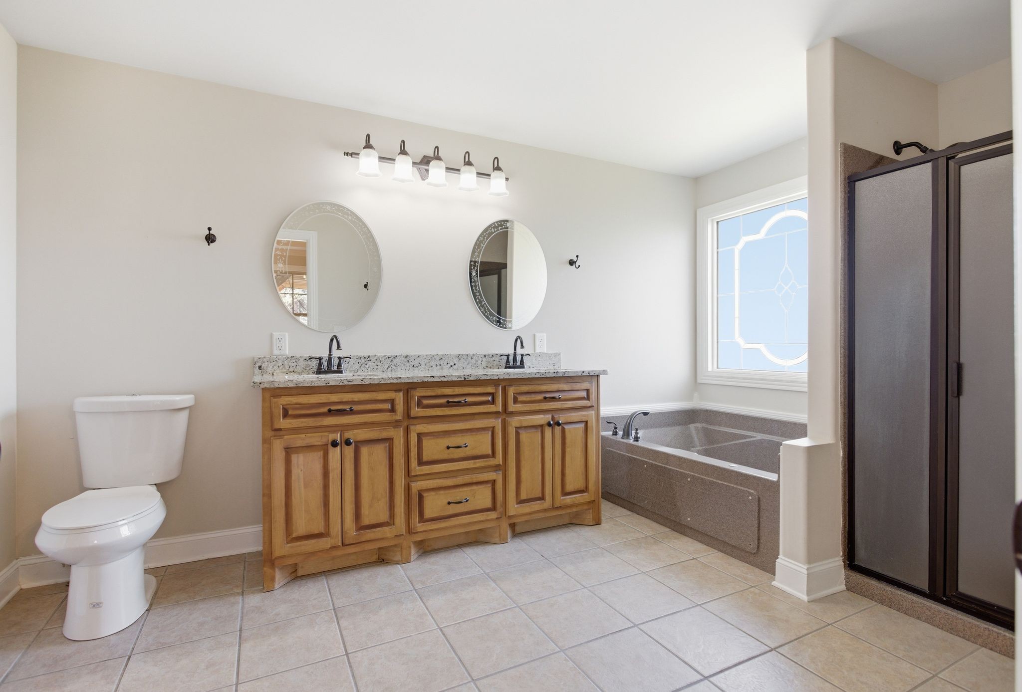 408 Weakley Creek Road Lawrenceburg, TN 38464 - Photo 18 of 41 a spacious bathroom with a granite countertop sink mirror toilet and bathtub