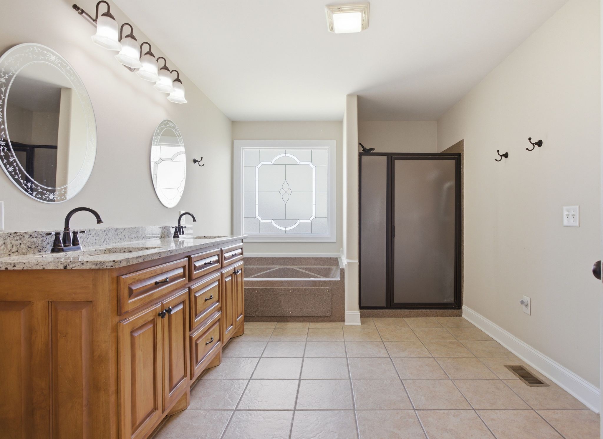408 Weakley Creek Road Lawrenceburg, TN 38464 - Photo 19 of 41 a spacious bathroom with a double vanity sink and a mirror