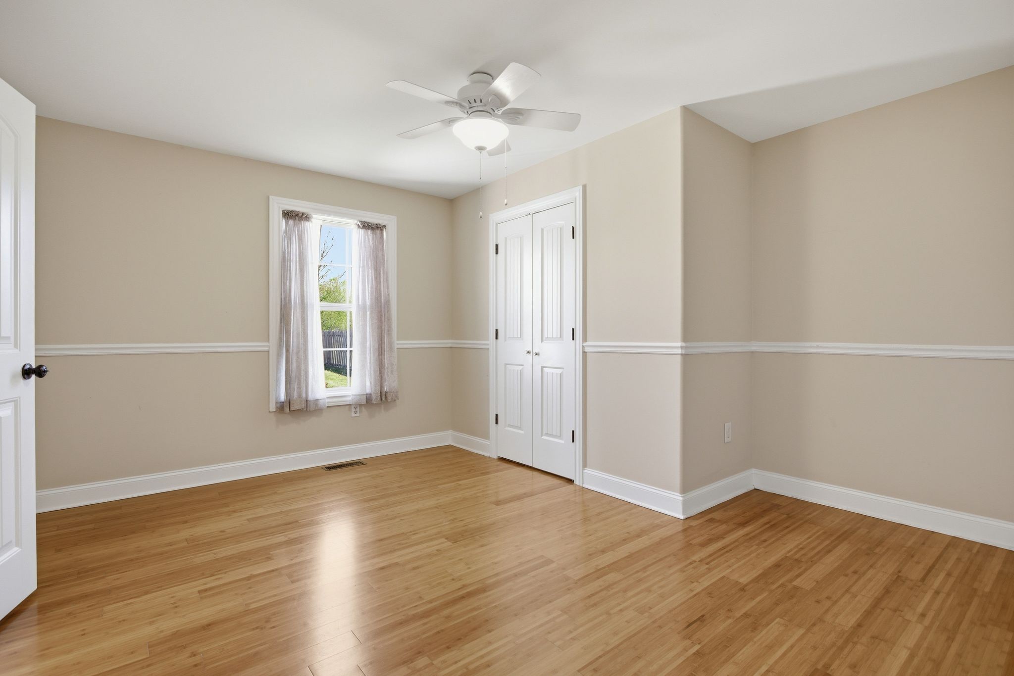 408 Weakley Creek Road Lawrenceburg, TN 38464 - Photo 28 of 41 an empty room with wooden floor and window