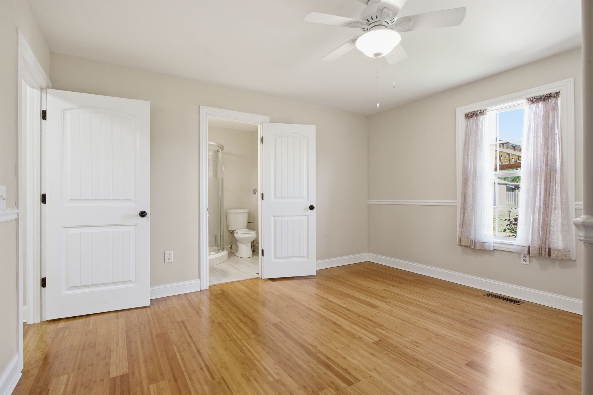 408 Weakley Creek Road Lawrenceburg, TN 38464 - Photo 29 of 41 an empty room with wooden floor and windows
