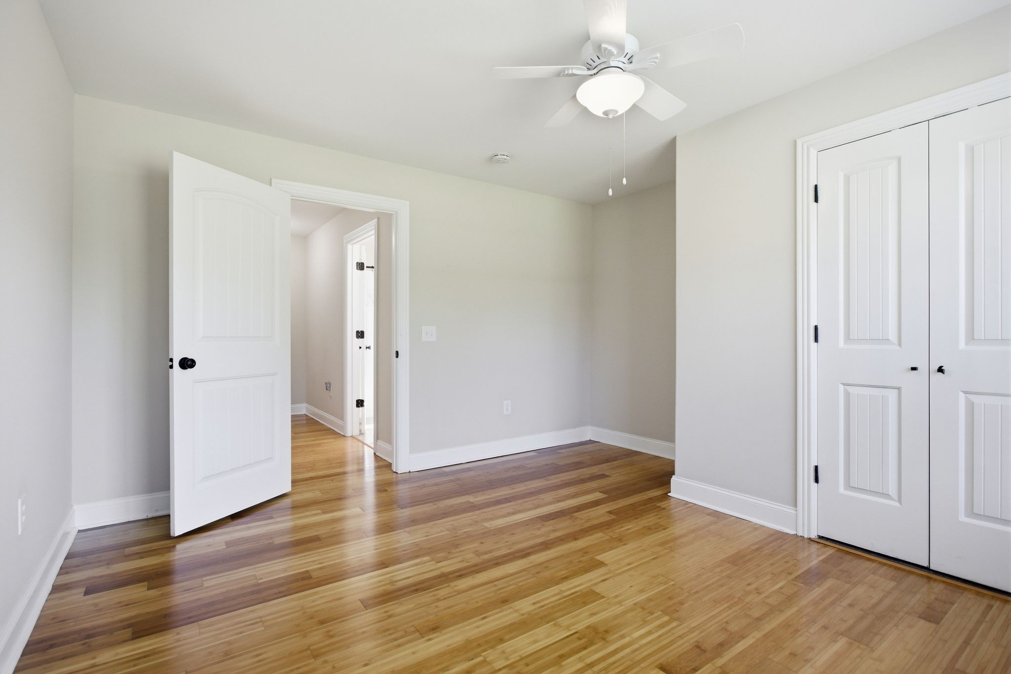 408 Weakley Creek Road Lawrenceburg, TN 38464 - Photo 31 of 41 an empty room with wooden floor and windows