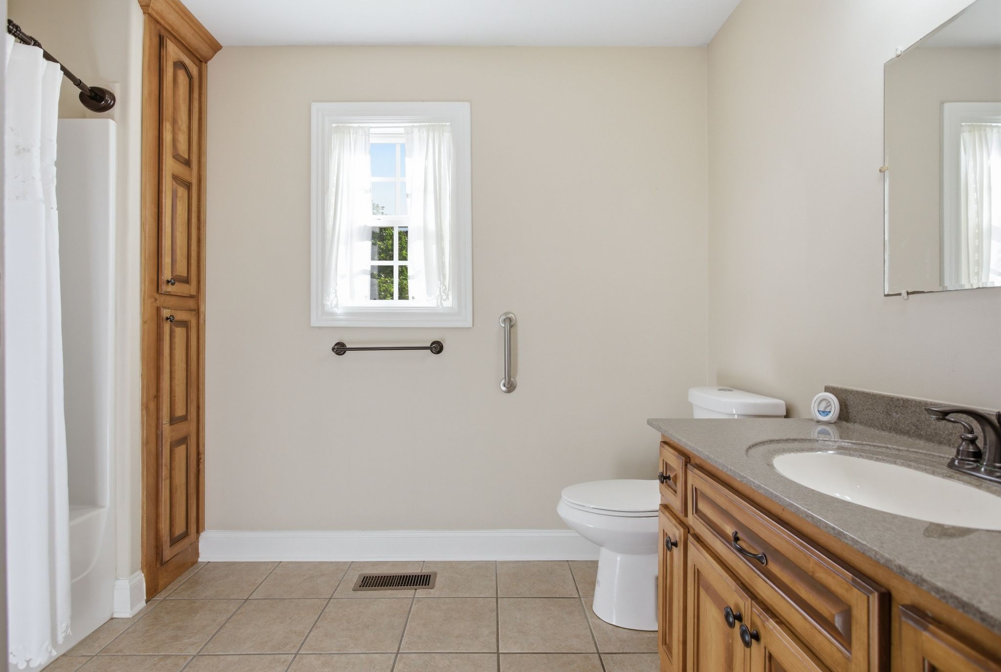408 Weakley Creek Road Lawrenceburg, TN 38464 - Photo 32 of 41 a bathroom with a granite countertop sink toilet and mirror