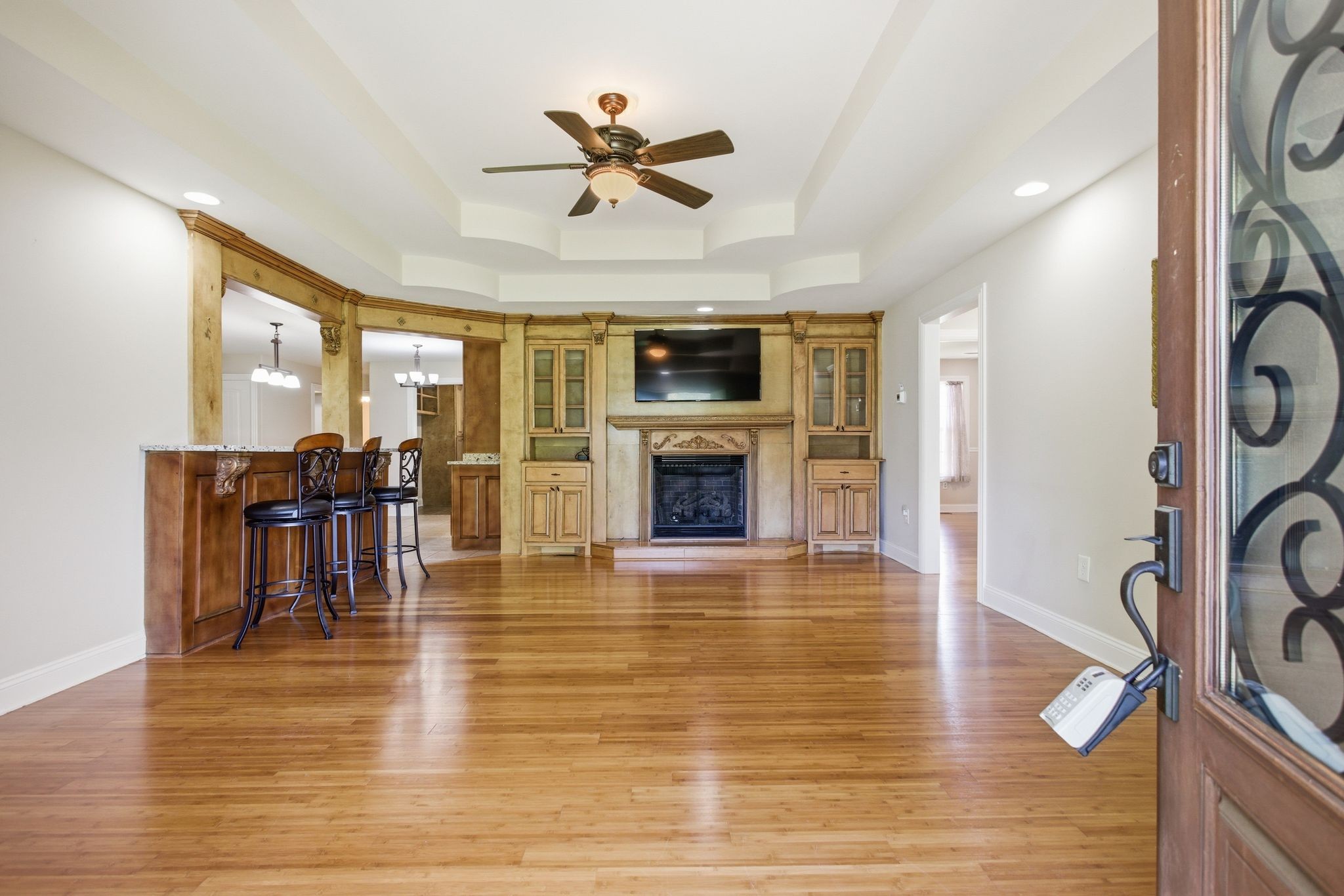 408 Weakley Creek Road Lawrenceburg, TN 38464 - Photo 6 of 41 a view of a livingroom with furniture a fireplace wooden floor and a window