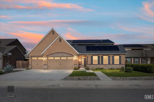 a house with trees in the background