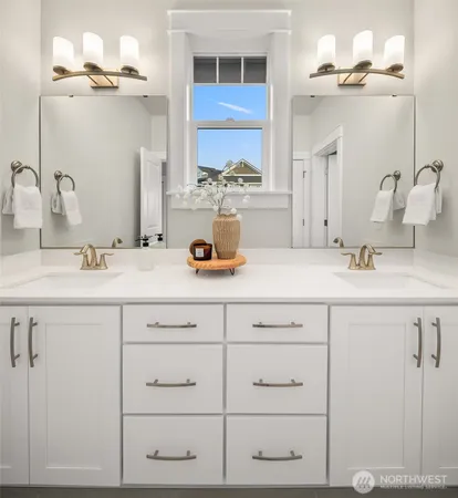a bathroom with a sink vanity and a mirror