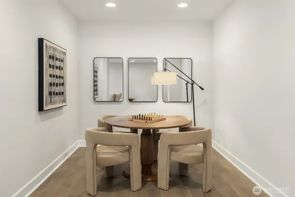 a view of a room with furniture and wooden floor