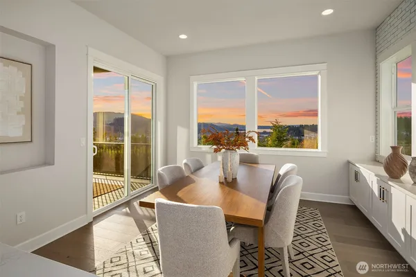 a dining room with furniture and windows