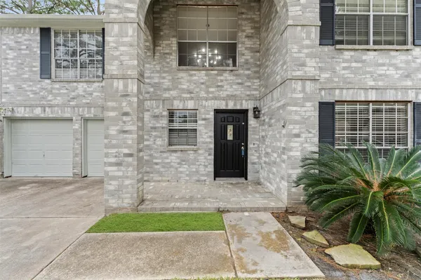 a front view of a house with yard