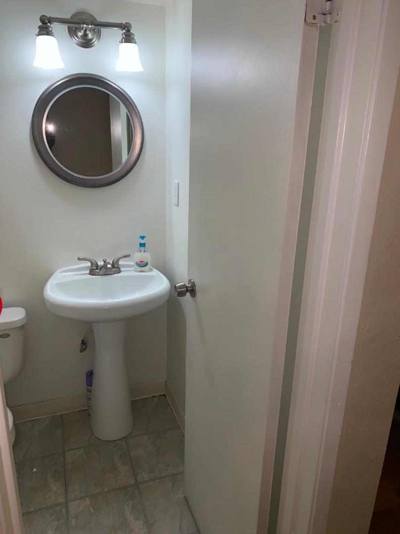 2043 Sierra Road, Unit 1 Concord, CA 94518 - Photo 13 of 34 a bathroom with a sink toilet and mirror