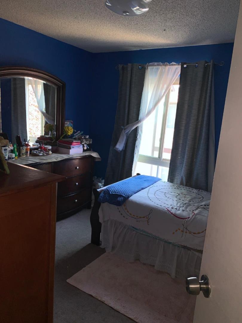2043 Sierra Road, Unit 1 Concord, CA 94518 - Photo 14 of 34 a bedroom with a bed and window