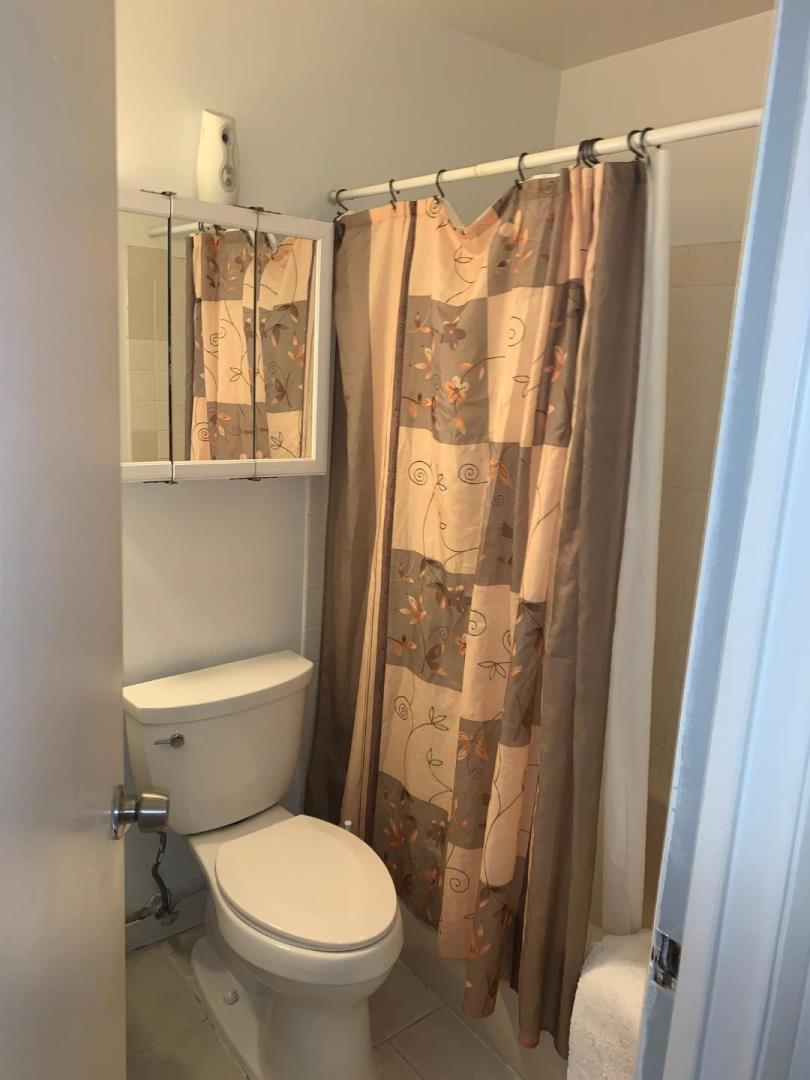 2043 Sierra Road, Unit 1 Concord, CA 94518 - Photo 17 of 34 a white toilet sitting next to a bathroom sink