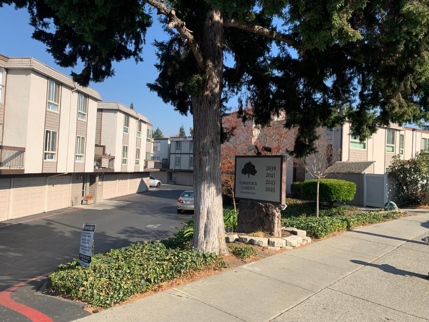 2043 Sierra Road, Unit 1 Concord, CA 94518 - Photo 32 of 34 a view of a street with potted plants and large trees