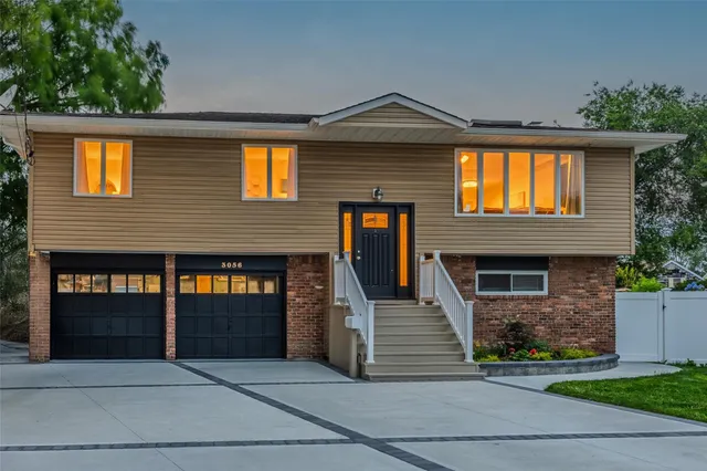 a front view of a house with garage