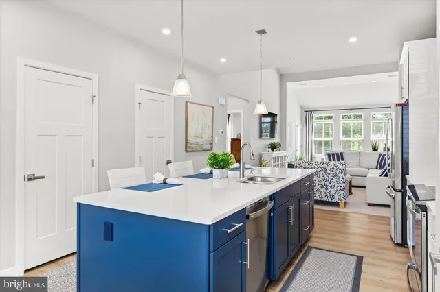 a bathroom with a sink double vanity granite and a large mirror