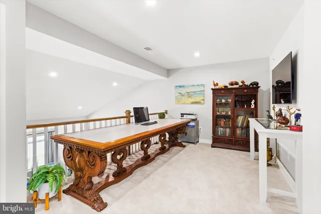 a bathroom with a sink a toilet a tub and shower