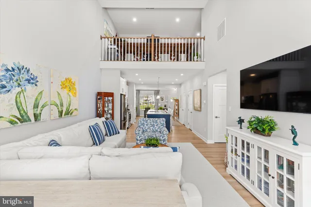 a view of living room and wooden floor