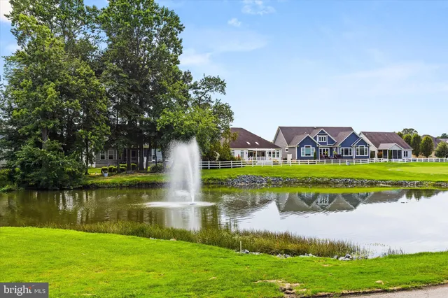 a view of a house with a yard and a large pool