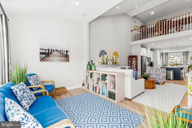 a bedroom with a bed and a potted plant