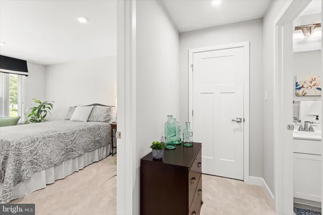 a kitchen with stainless steel appliances a sink stove refrigerator and cabinets