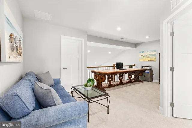 a bedroom with bed and a potted plant