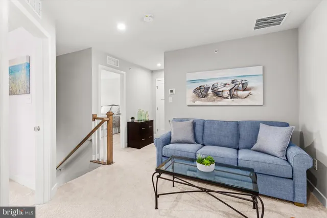 a building outdoor space with patio furniture and potted plants