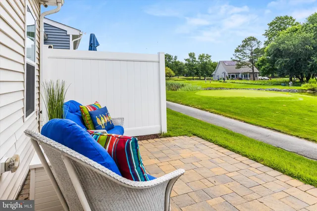 a view of swimming pool with outdoor seating