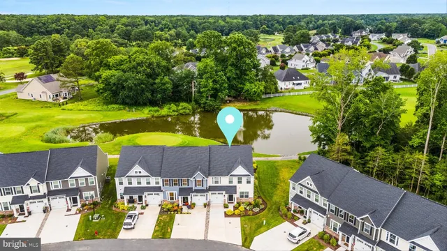 a view of a two chairs in the back yard of the house