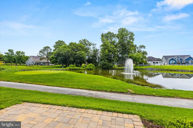 an aerial view of a tennis ground and a swimming pool