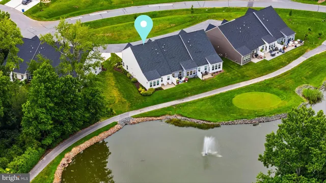 an aerial view of a house with a swimming pool yard and outdoor seating