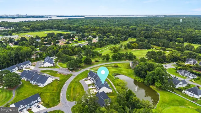 an aerial view of a swimming pool a yard and mountain