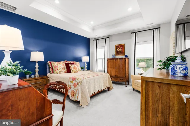 a bedroom with a bed lamps and window