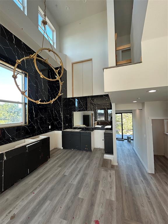 1401 Seegar Street Dallas, TX 75215 - Photo 14 of 17 a kitchen with stainless steel appliances wooden floor window and cabinets