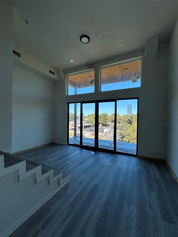 1401 Seegar Street Dallas, TX 75215 - Photo 7 of 17 wooden floor in an empty room with a window