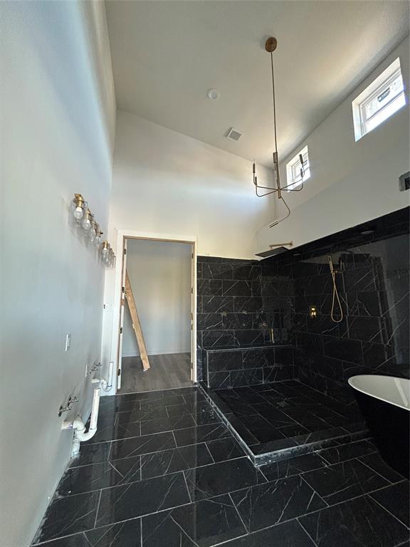 1401 Seegar Street Dallas, TX 75215 - Photo 9 of 17 a bathroom with a glass shower door and a sink
