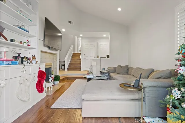 a living room with furniture and flat screen tv