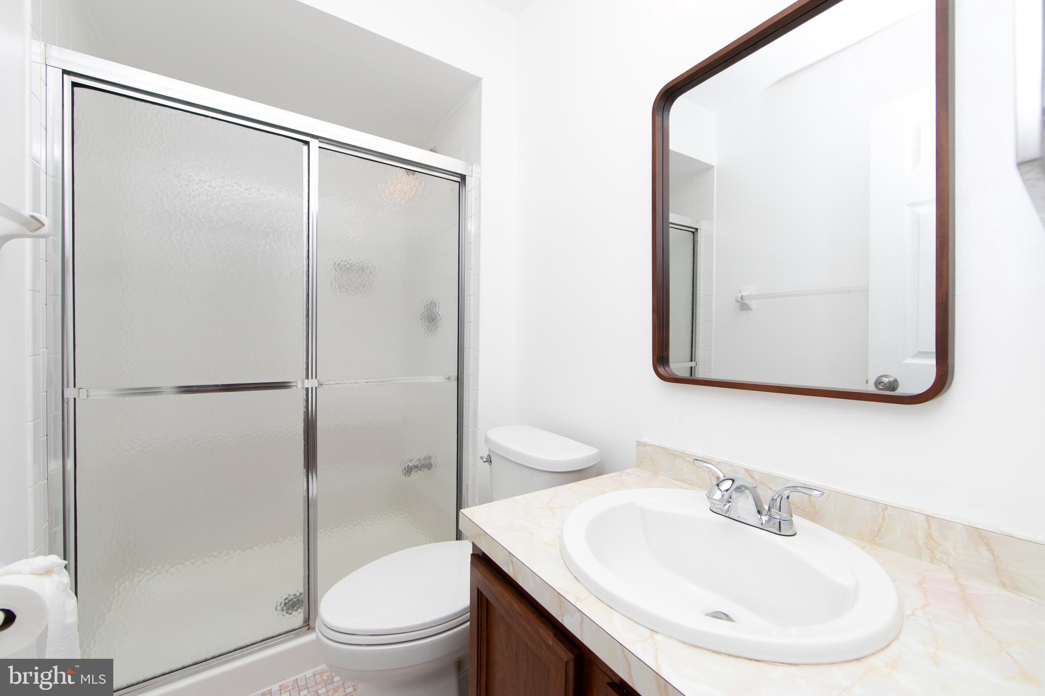 3007 Rampart Road Bensalem, PA 19020 - Photo 29 of 48 a bathroom with a sink a toilet and shower