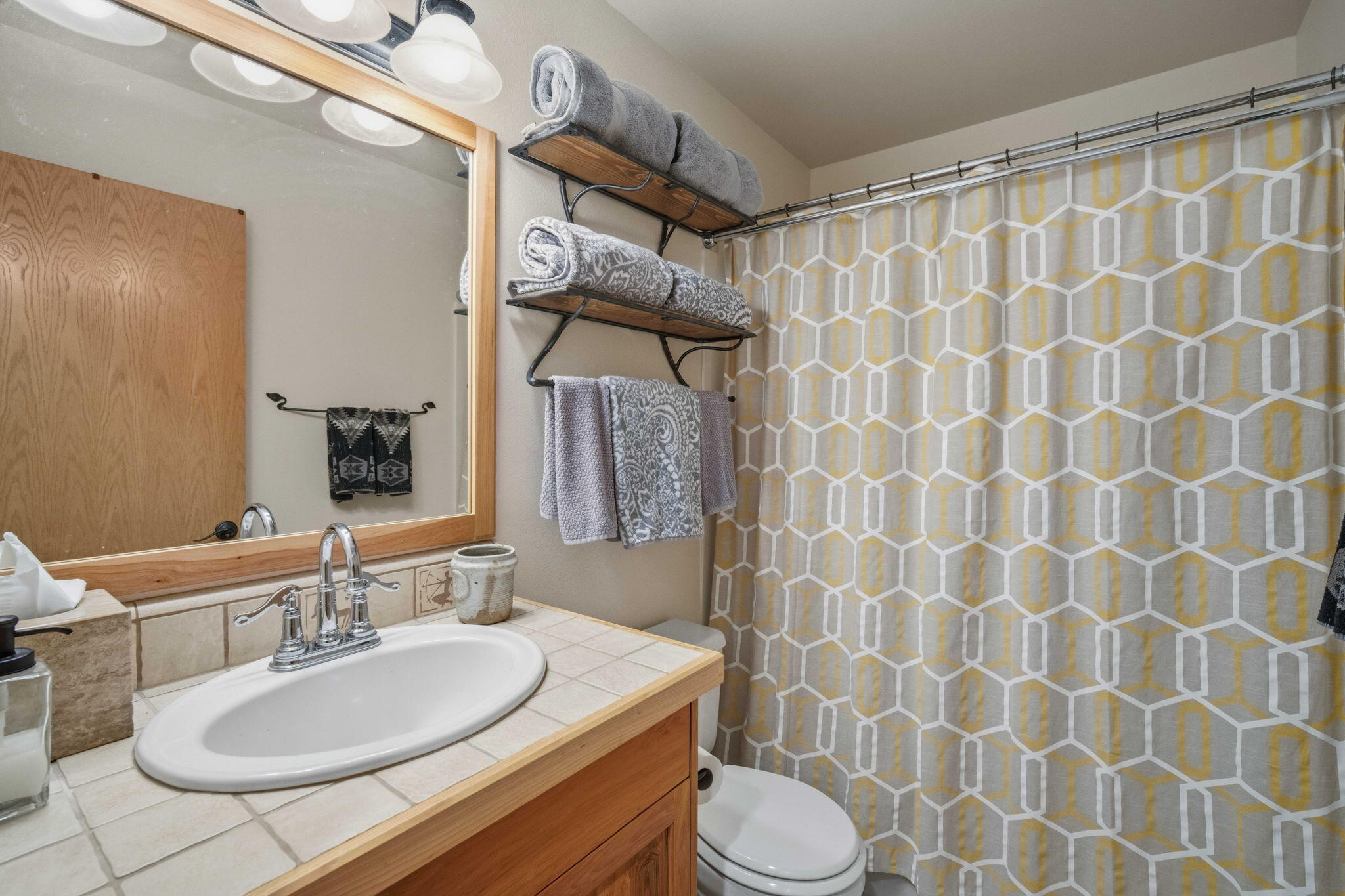 17682 Bittern Lane, Unit 31 Sunriver, OR 97707 - Photo 37 of 44 a bathroom with a sink and a mirror